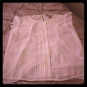 White shirt with blue polka dots.